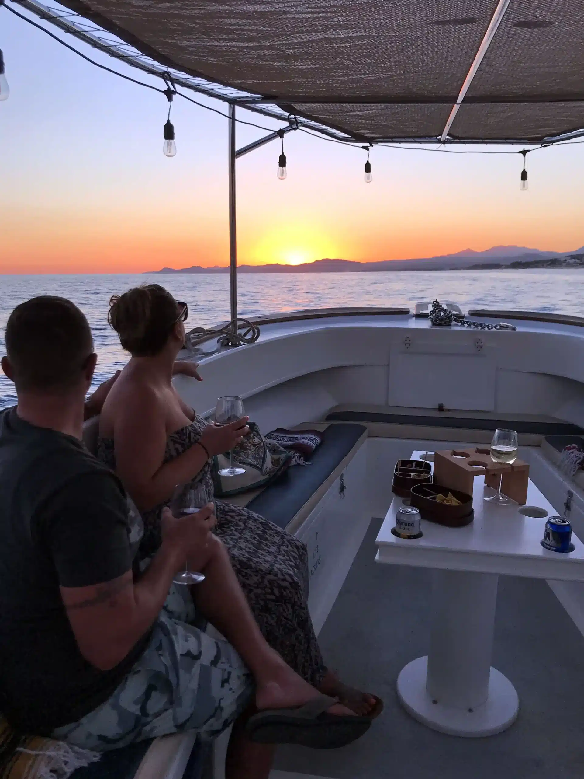 Small group enjoying a sunset cruise from Puerto Los Cabos