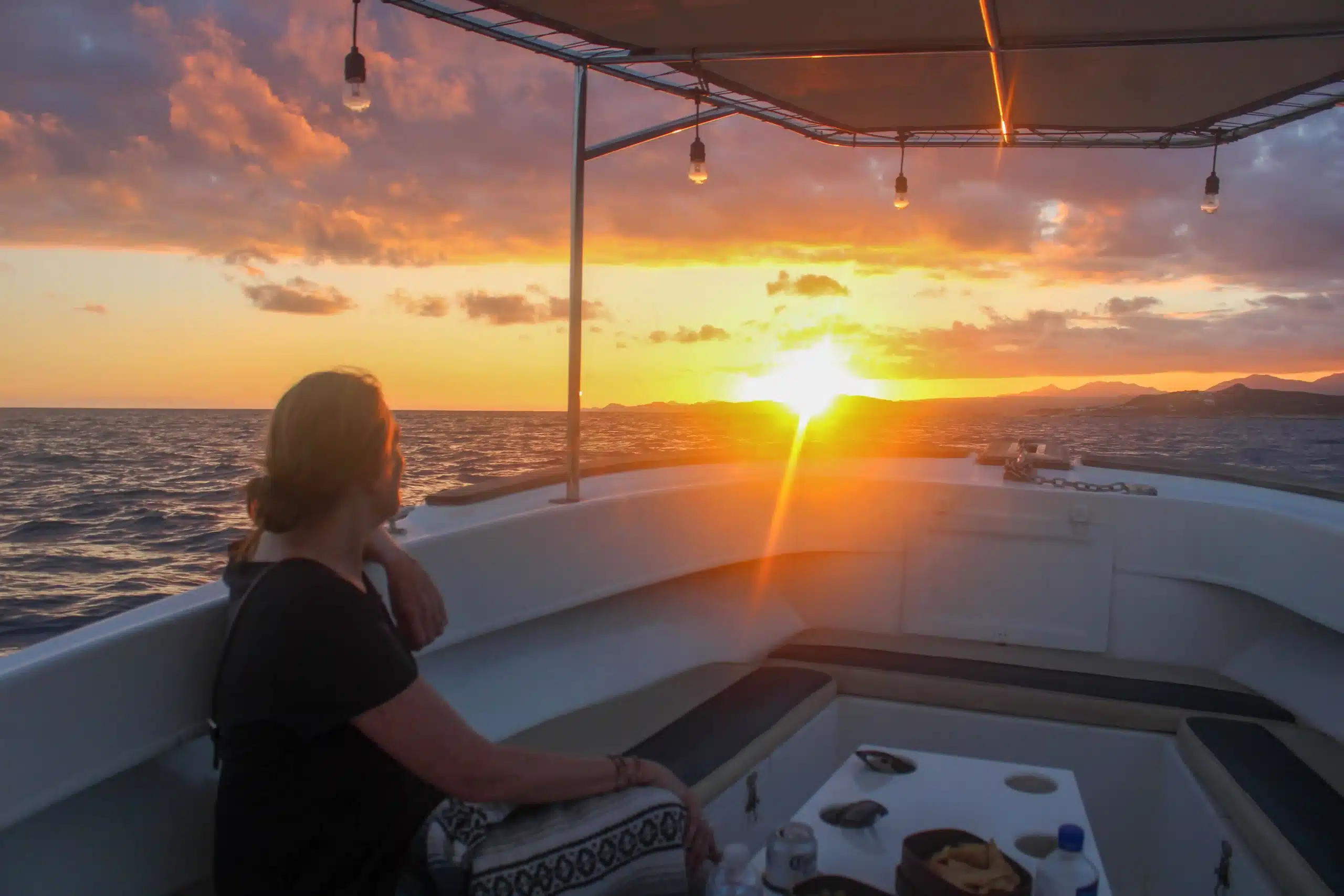 Woman relaxing during a quiet San Jos&eacute; del Cabo boat sunset